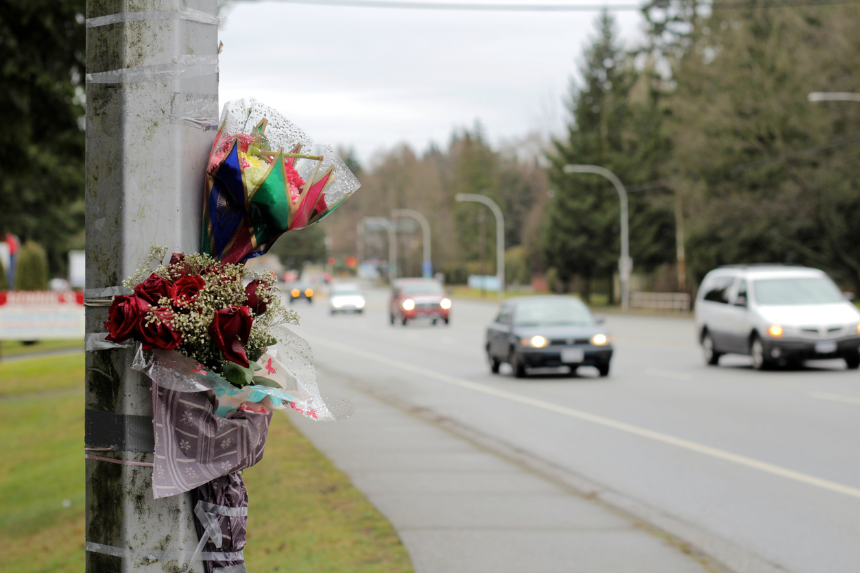 Cars Pass By Roadside Memorial Accident Scene