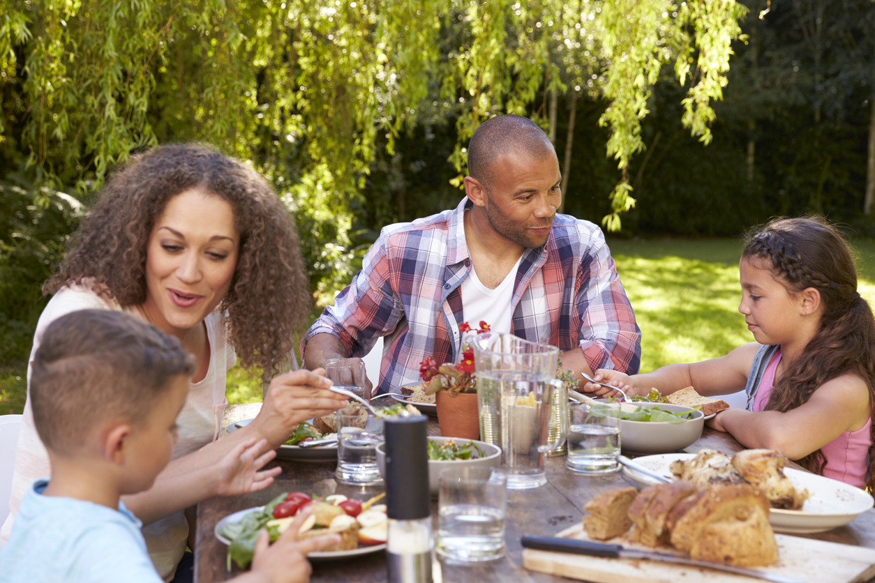 Family Eating Outdoor Meal on Memorial Day